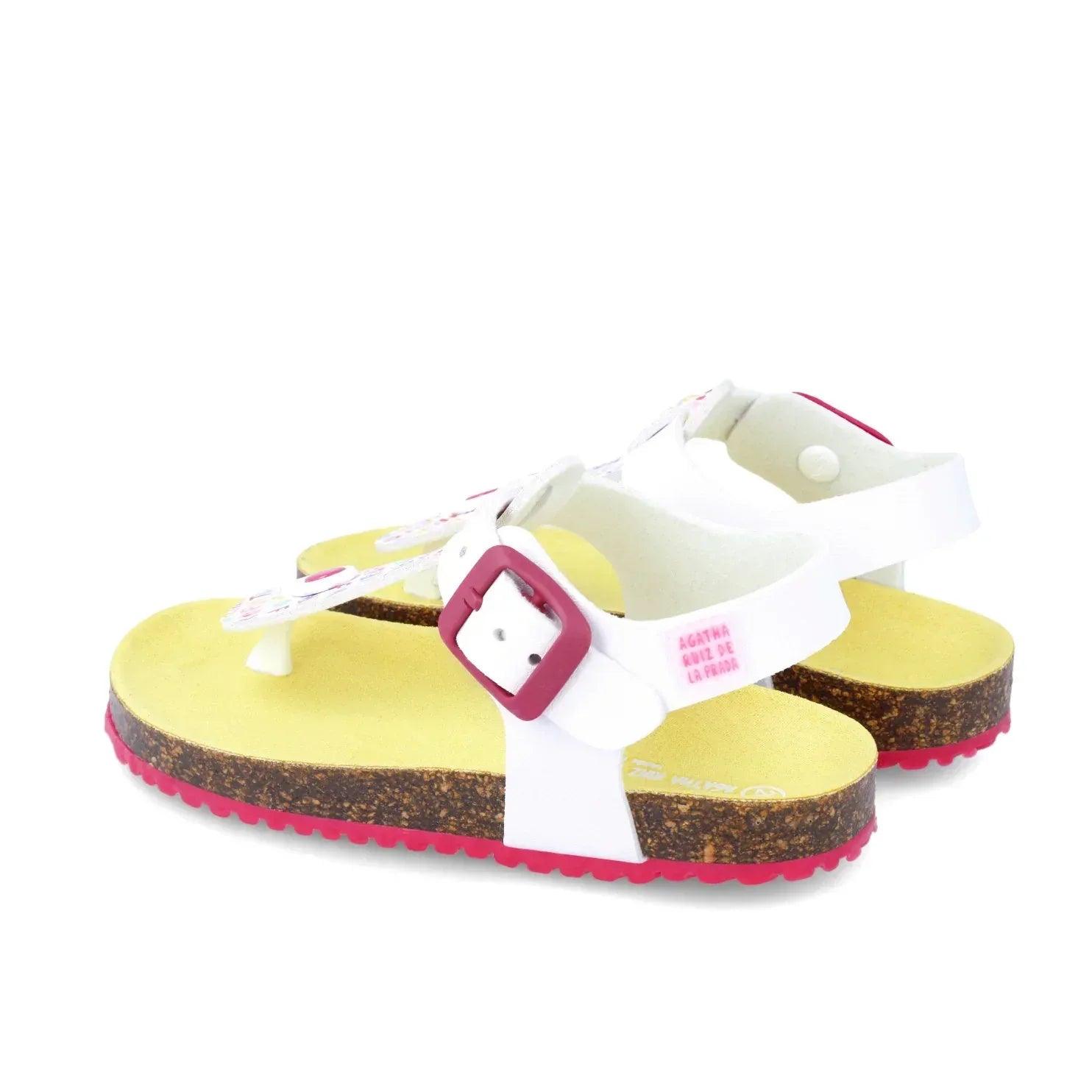Sandalia bio blanca con tira cruzada y hebilla fucsia, suela con borde rosa