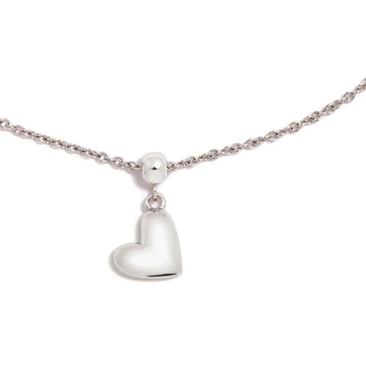 Charm de corazón plateado con anilla superior, acabado pulido