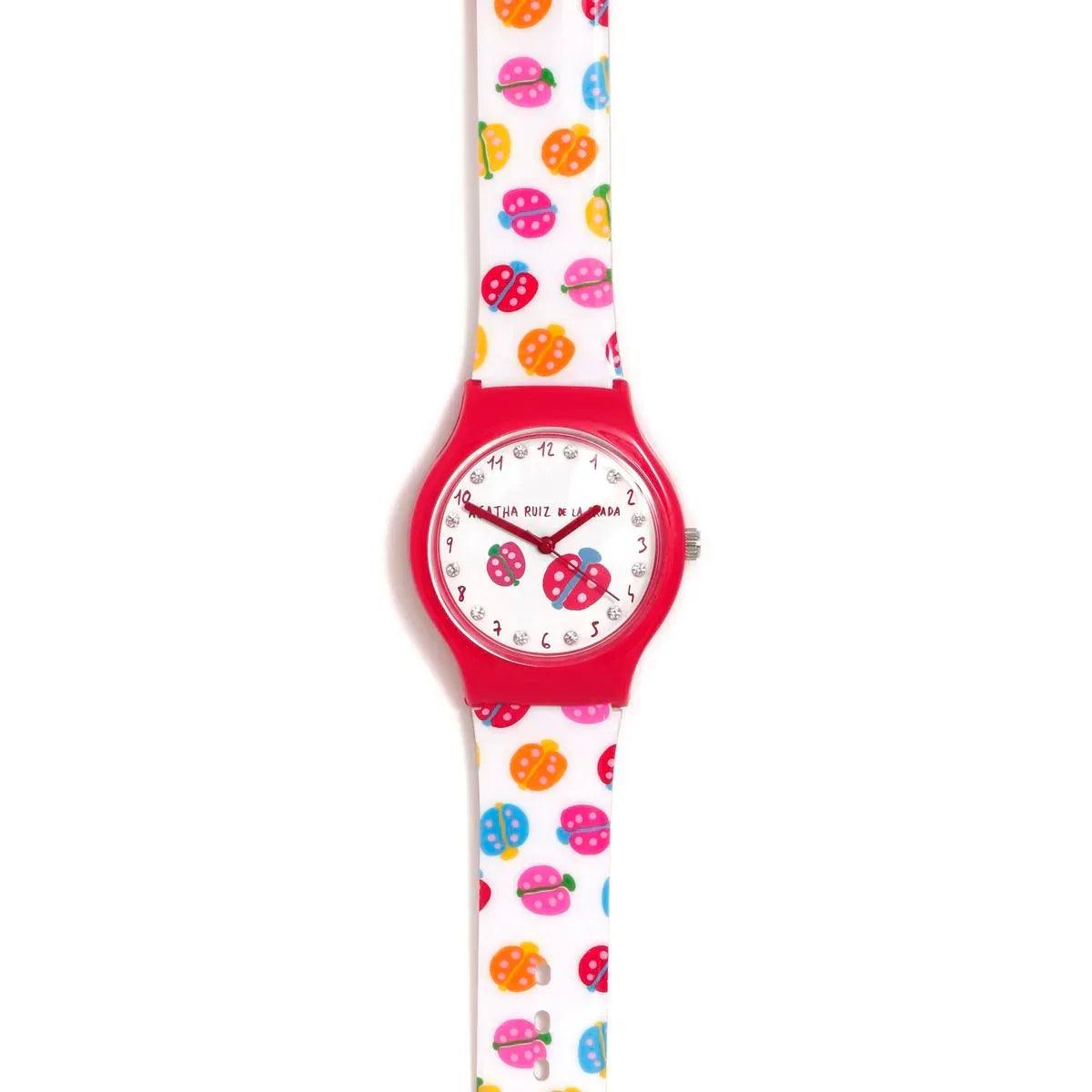 Reloj infantil con correa blanca y carátula roja, estampado de mariquitas