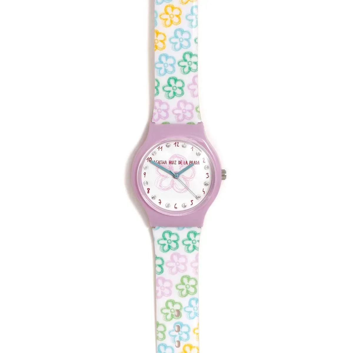 Reloj infantil con esfera circular y correa con flores, tonos pastel.