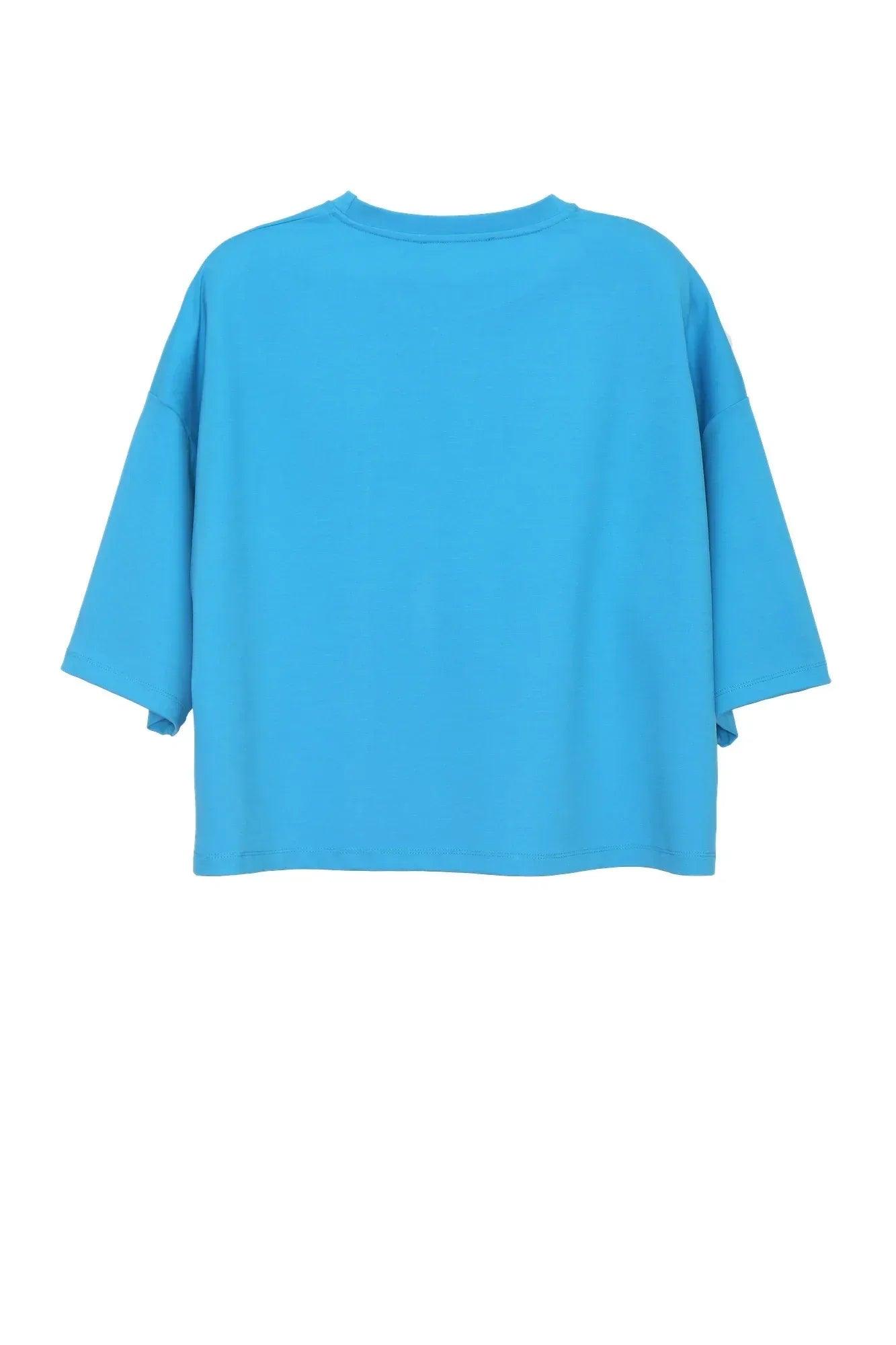Camiseta oversize turquesa lisa con cuello redondo y mangas holgadas