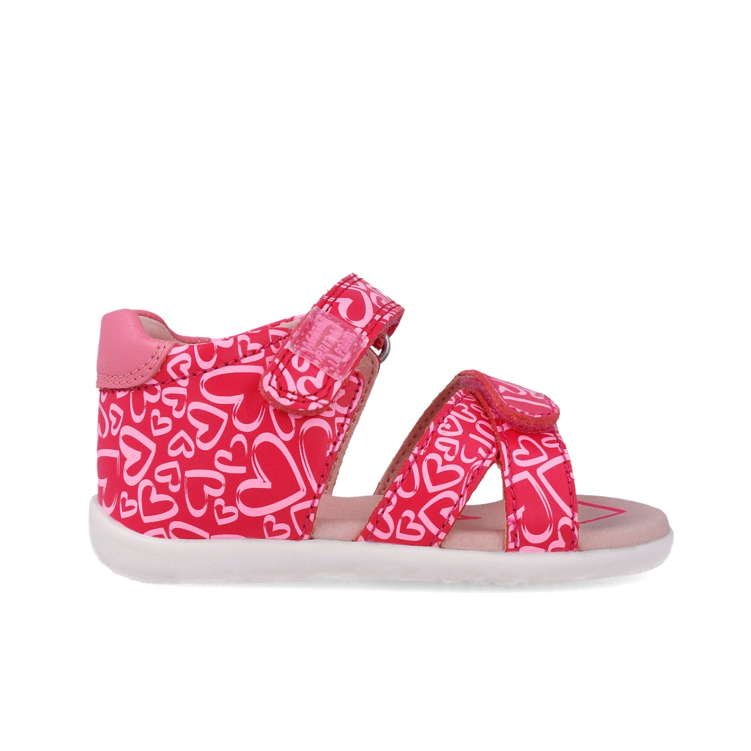 Sandalias fucsia estampadas con dos tiras y cierre, suela blanca.