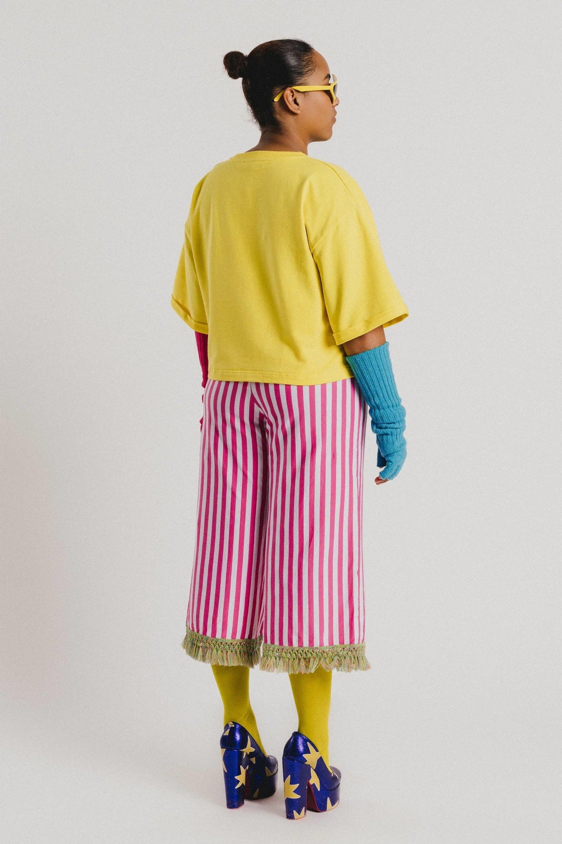 Pantalón culotte a rayas fucsia y blanco con flecos en el bajo
