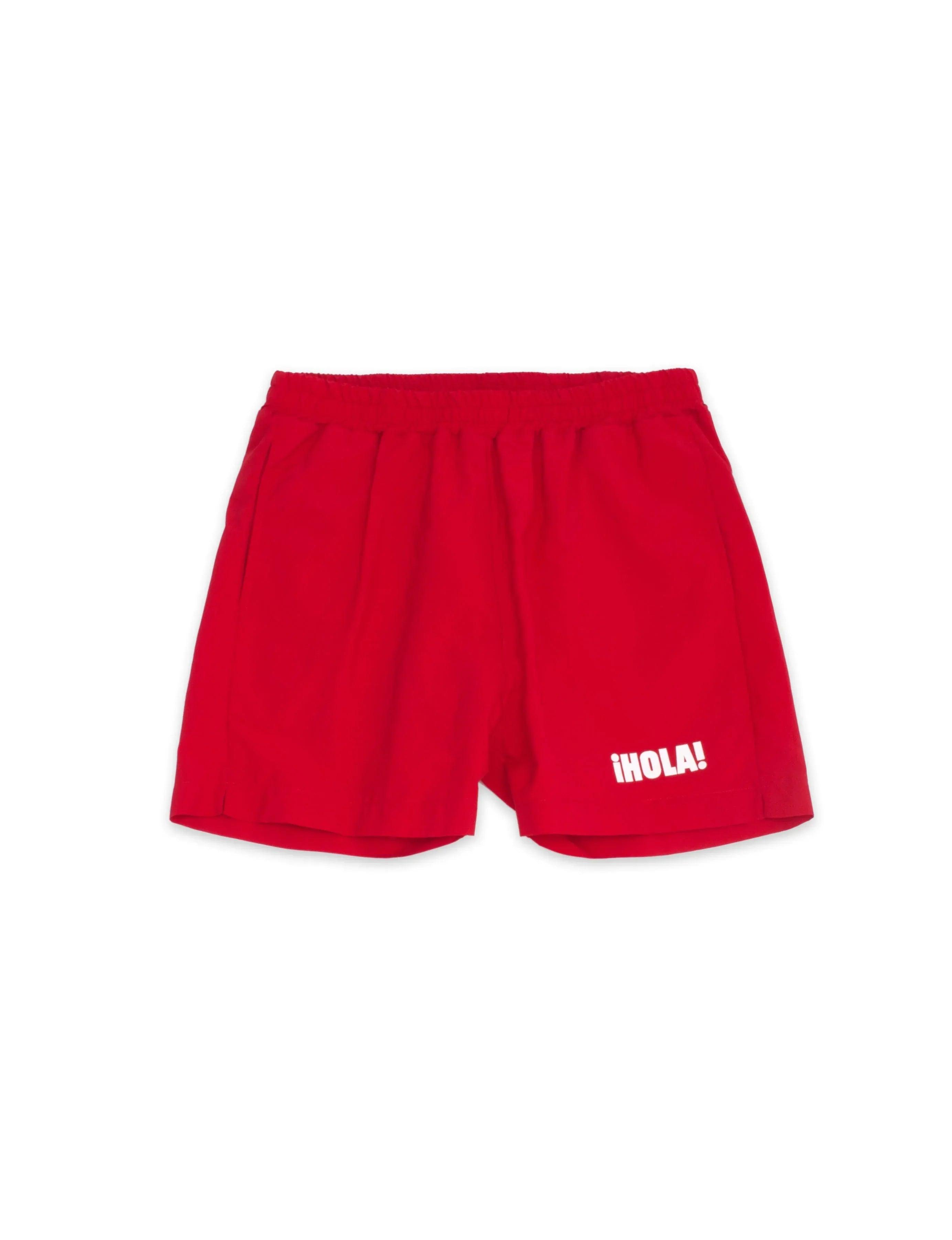 Bañador infantil rojo con cintura elástica y texto «¡HOLA!»