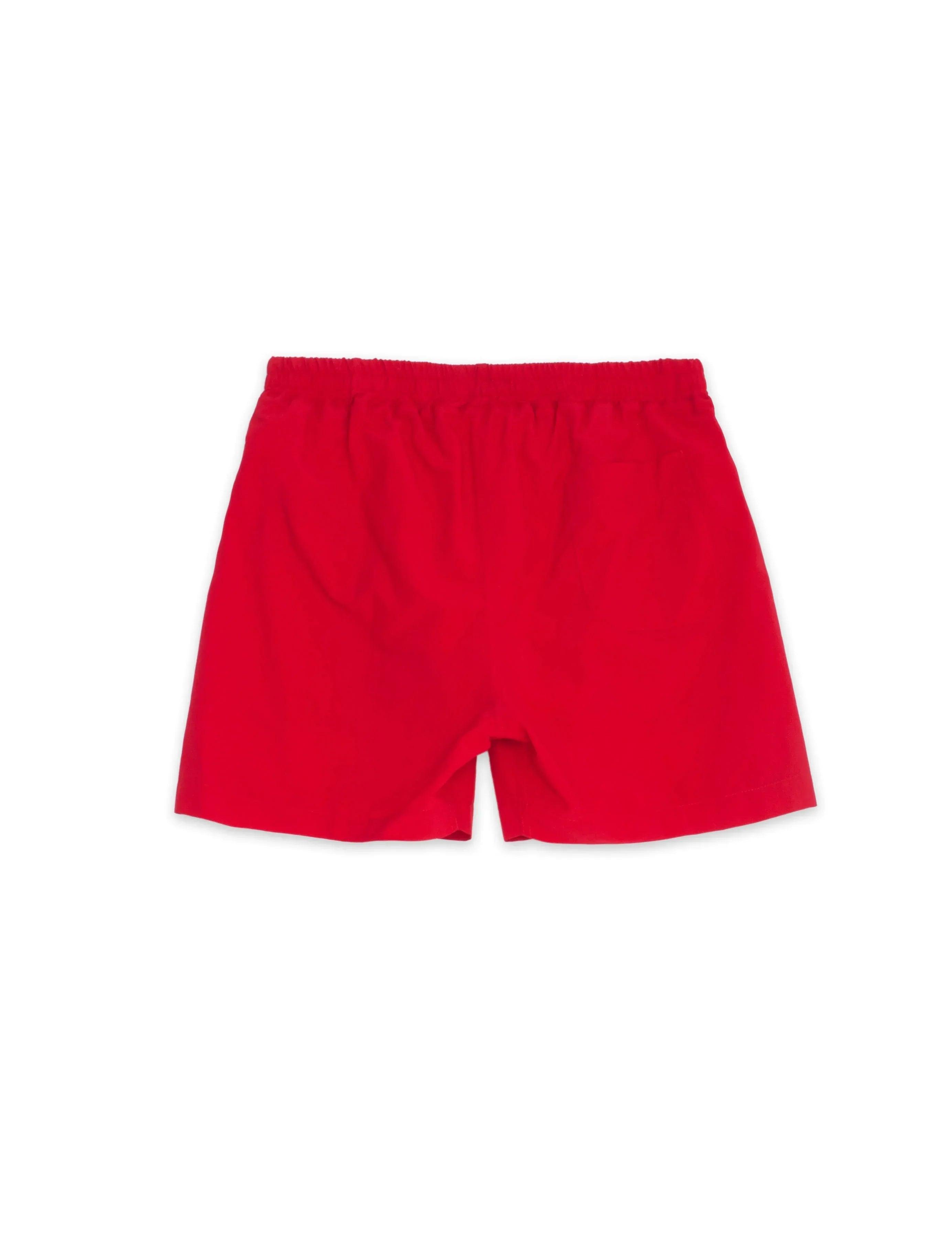Bañador infantil rojo con cintura elástica, vista trasera lisa