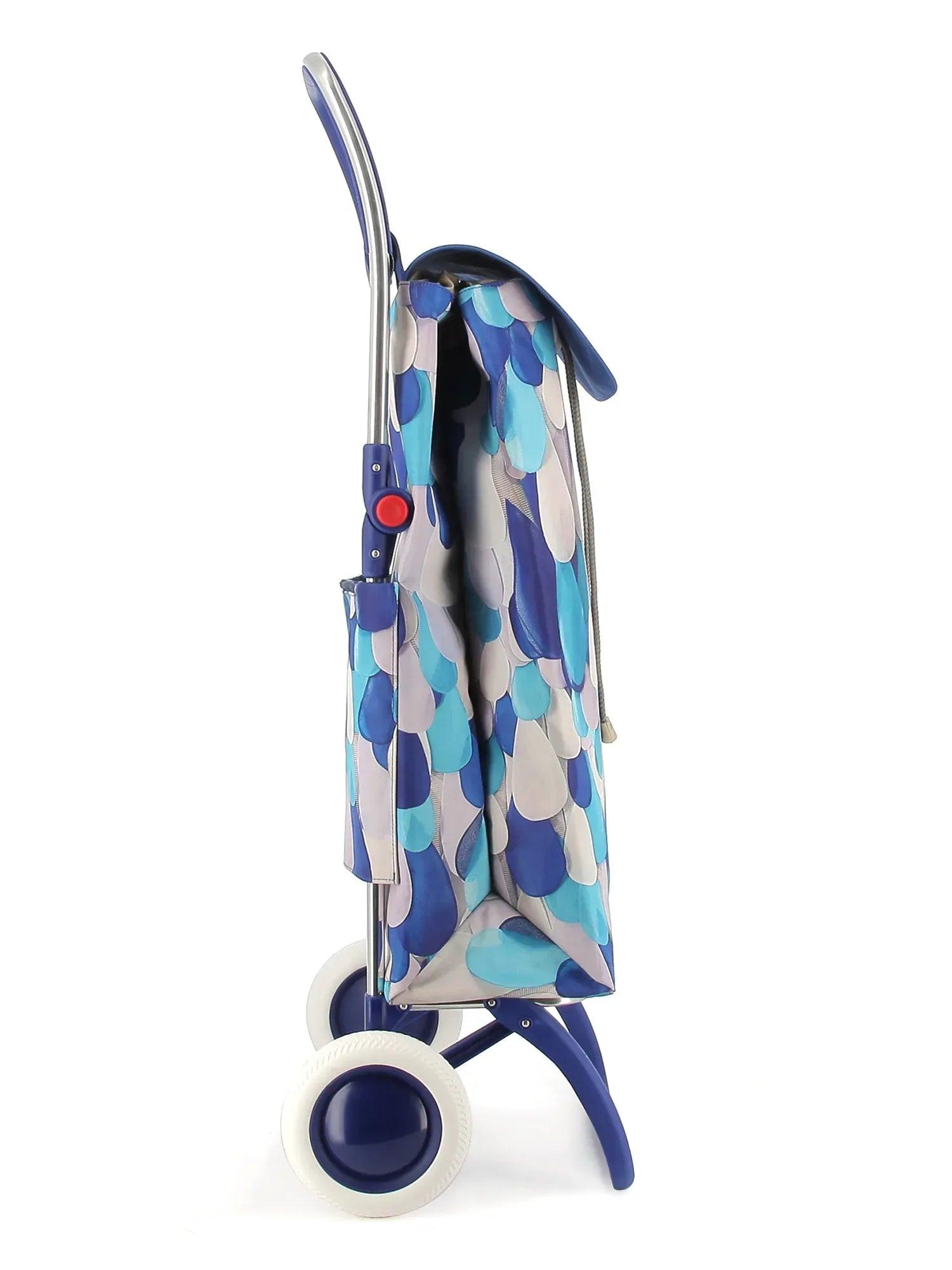 Carro plegable para bebé con capota estampada azul y blanco y ruedas giratorias