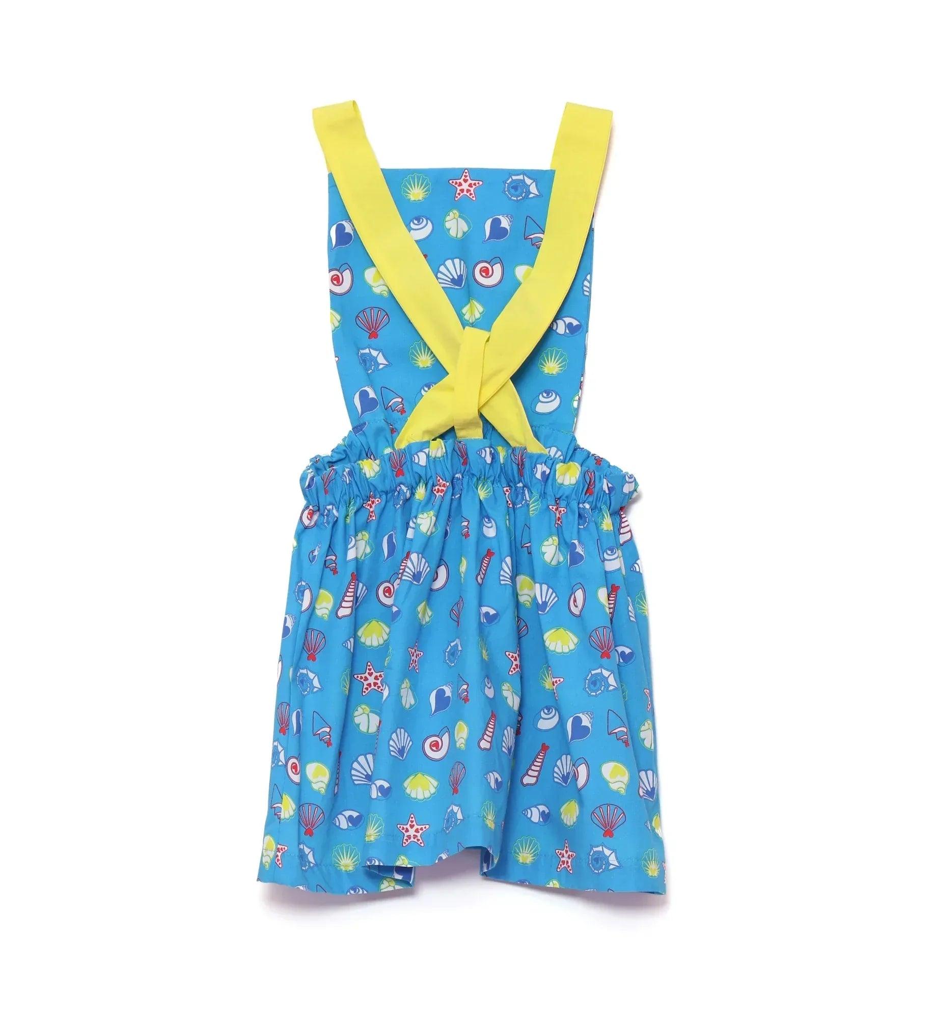 Vestido azul de tirantes amarillos con lazo trasero y estampado marino