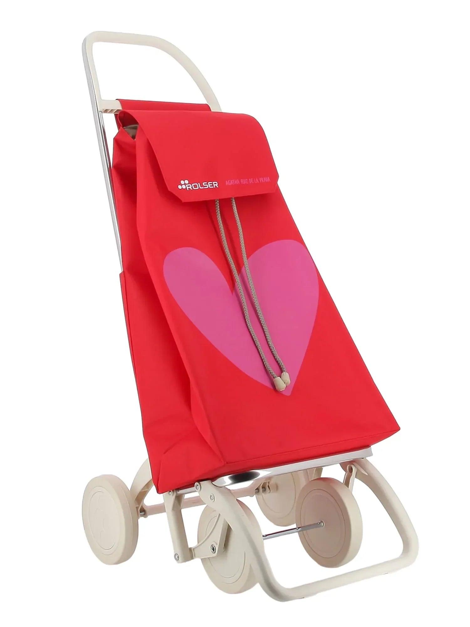 Carro de 4 ruedas rojo con asas blancas, funda con corazón morado y cordón
