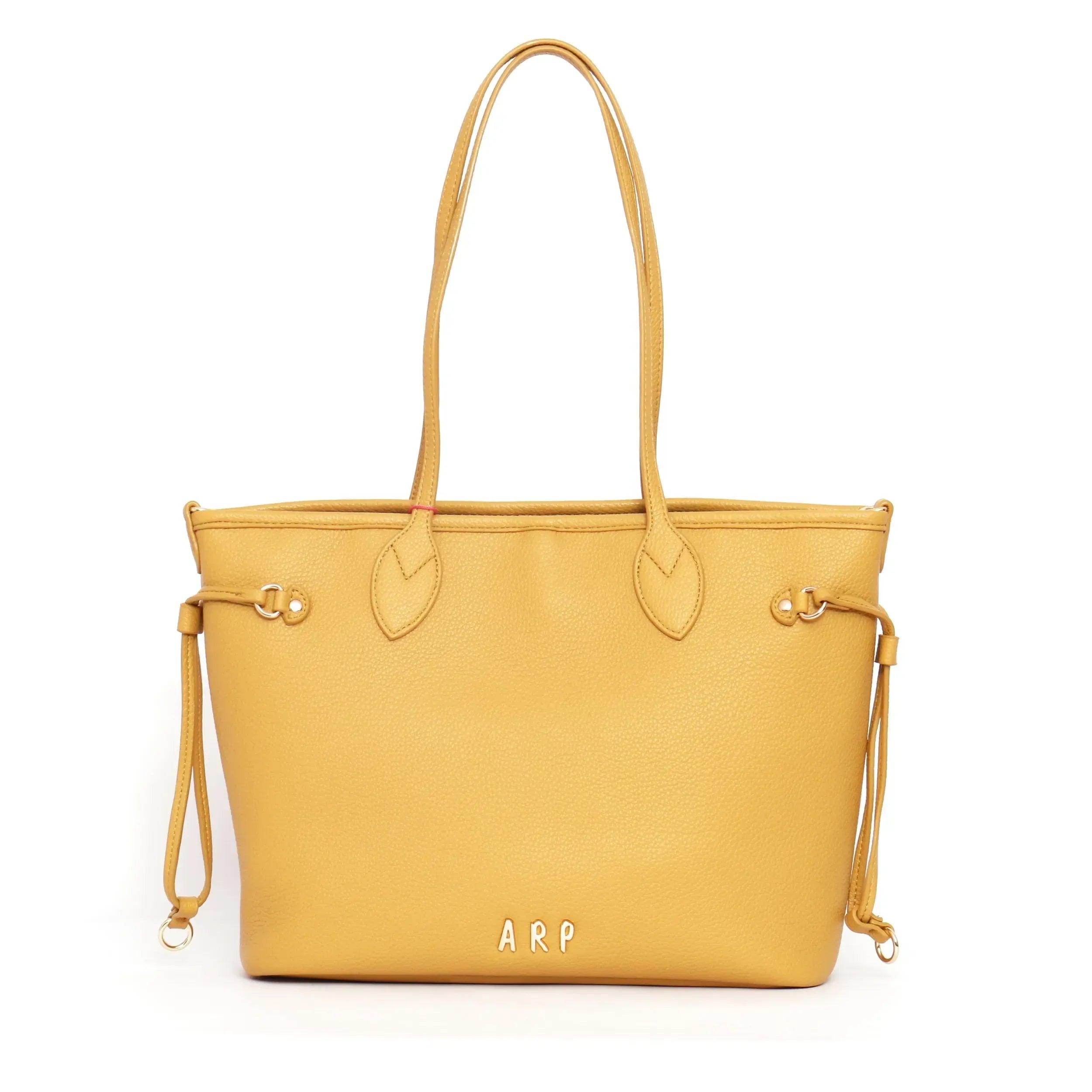 Bolso shopper reversible mostaza de cuero con asas largas y cierre metálico