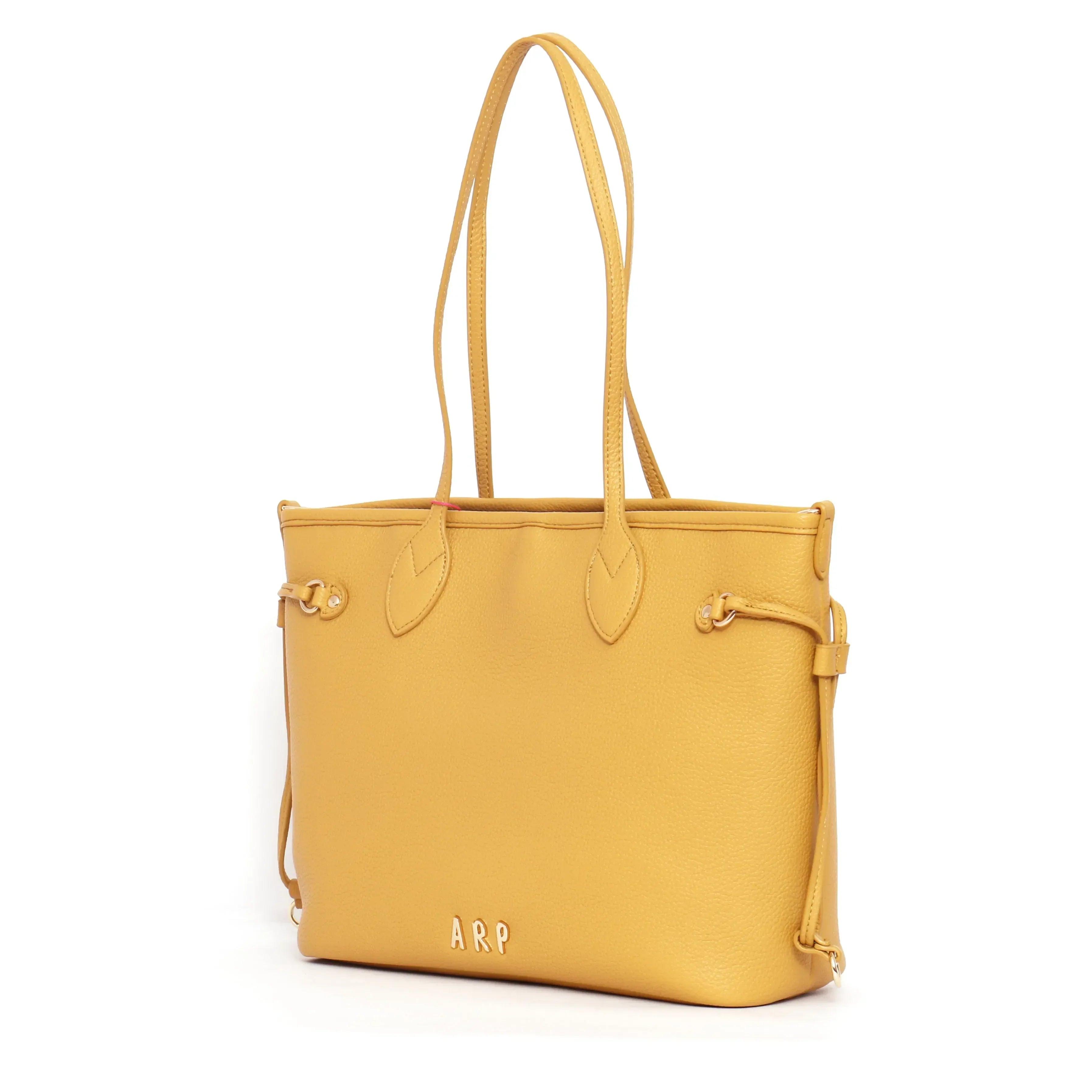 Bolso shopper reversible mostaza con bolsillos exteriores y correa colgante ajustable