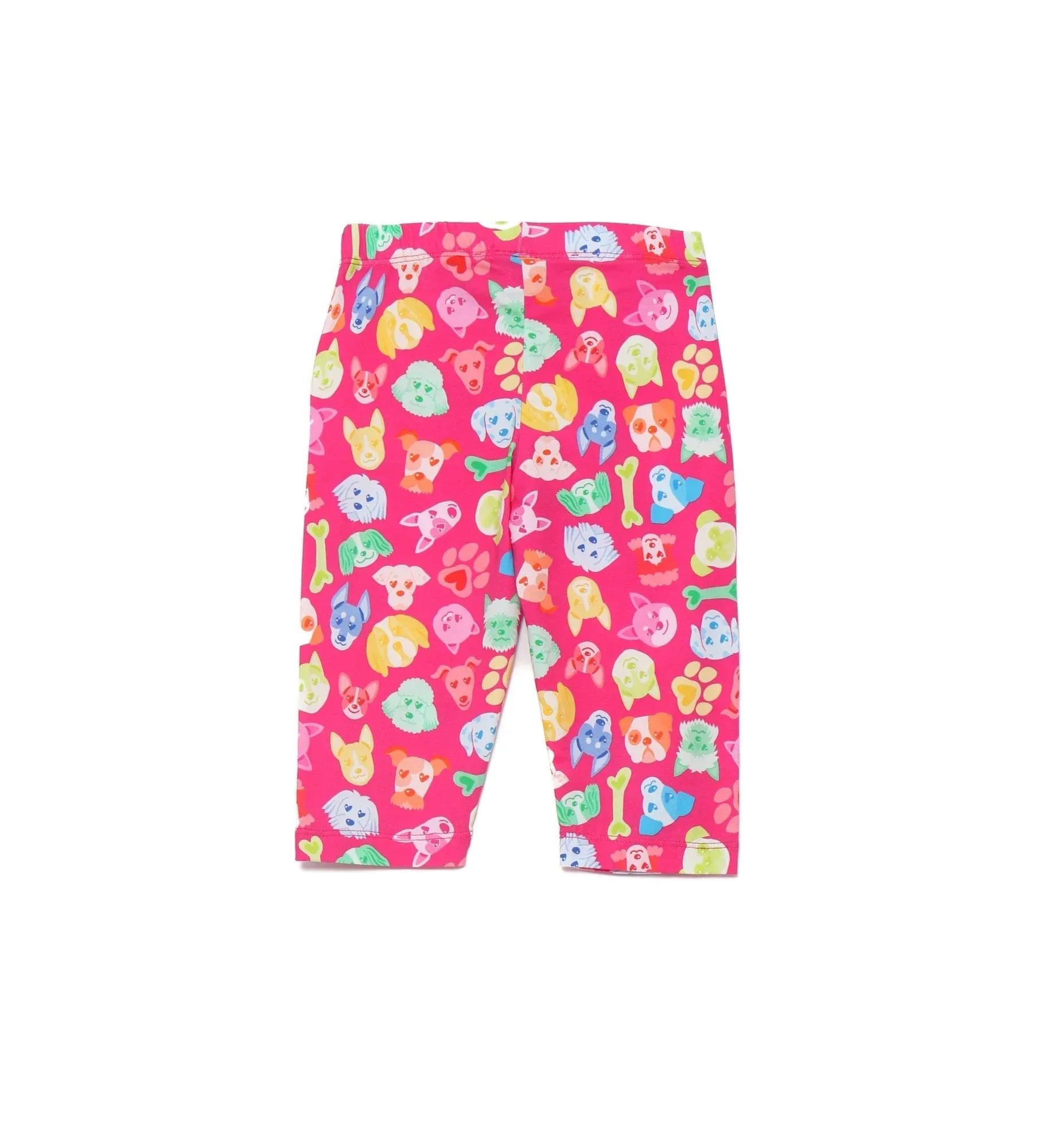 Legging multicolor con perritos pirata sobre fondo fucsia, cintura elástica