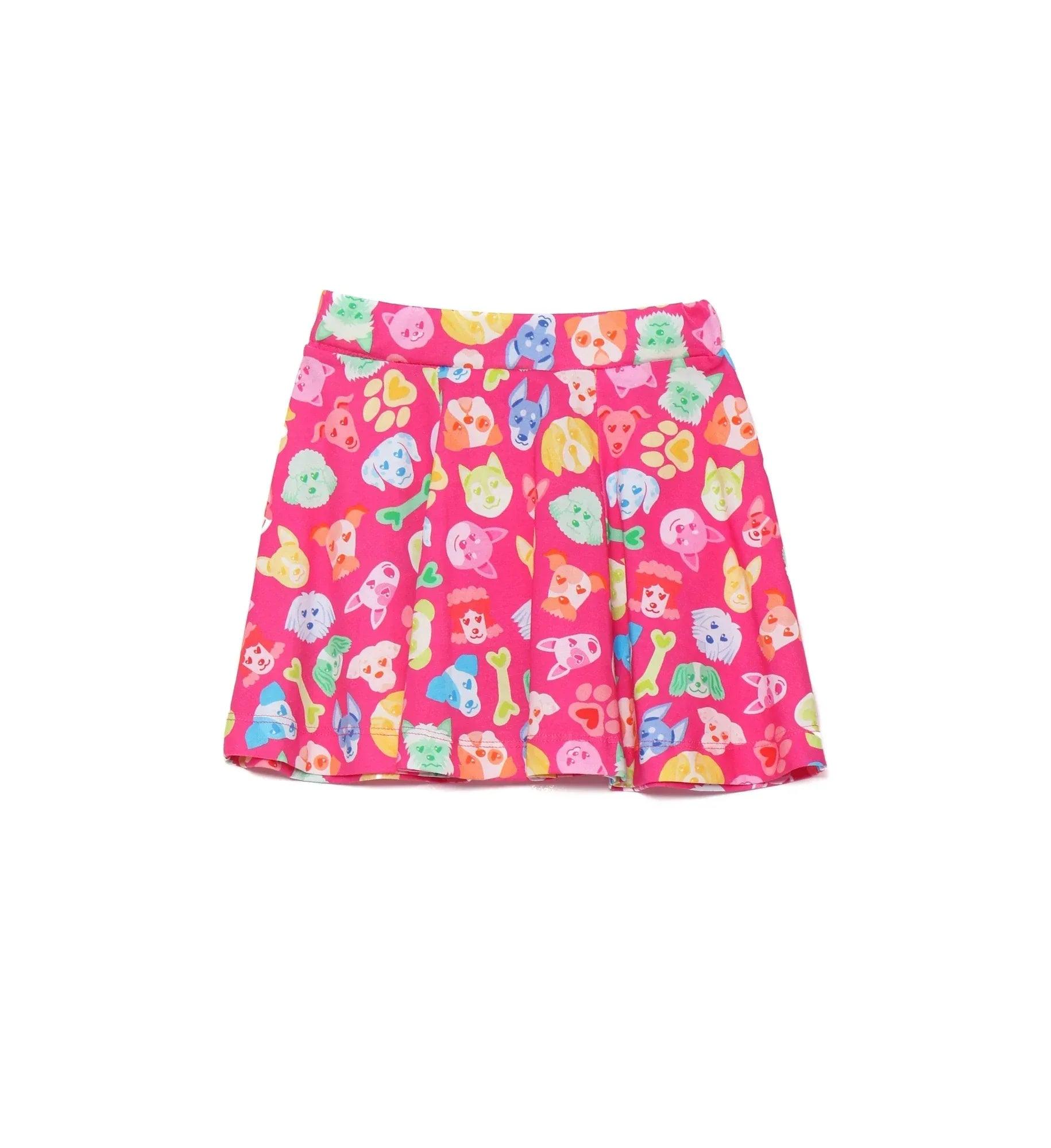 Falda fucsia estampada con perritos de colores y huellas, ruedo con vuelo